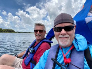 Jerry and Howard navigate Lake Dora in the cat boat.