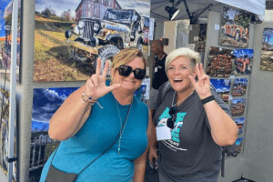 Two women smile to the camera at the Leesburg Arts Festival.