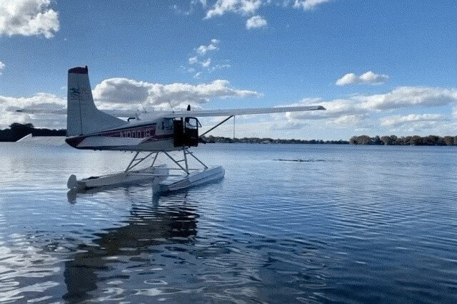 A seaplane sits on Lake Dora.